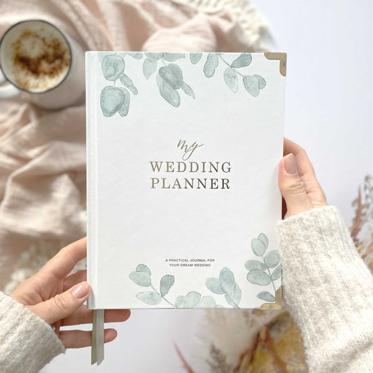 Luxury eucalyptus wedding planner book with gilded edge